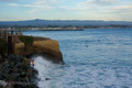 surfer headed out at Steamer Lane, Santa Cruz