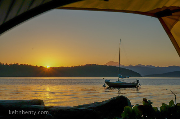 Sailboat "Stoke" at sunrise, view from tent on Cypress Island, WA