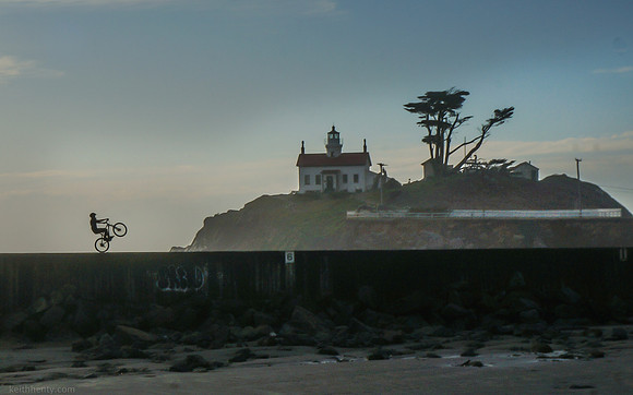 bike wheelie at Battery Pt. Lighthouse, Crescent City CA