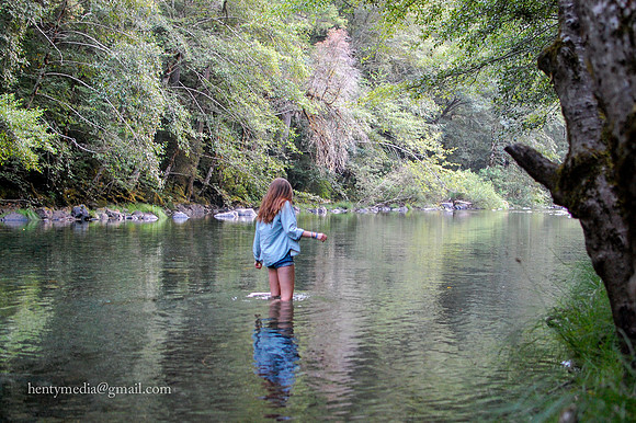 wading in Smith River, CA